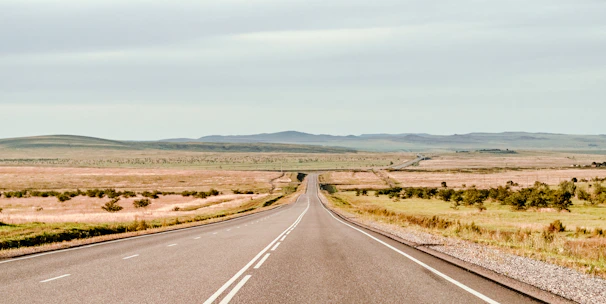 an empty road in the middle of nowhere