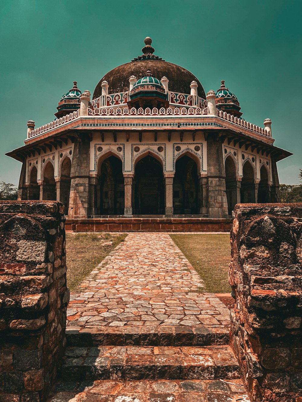 a large building with a stone walkway leading to it