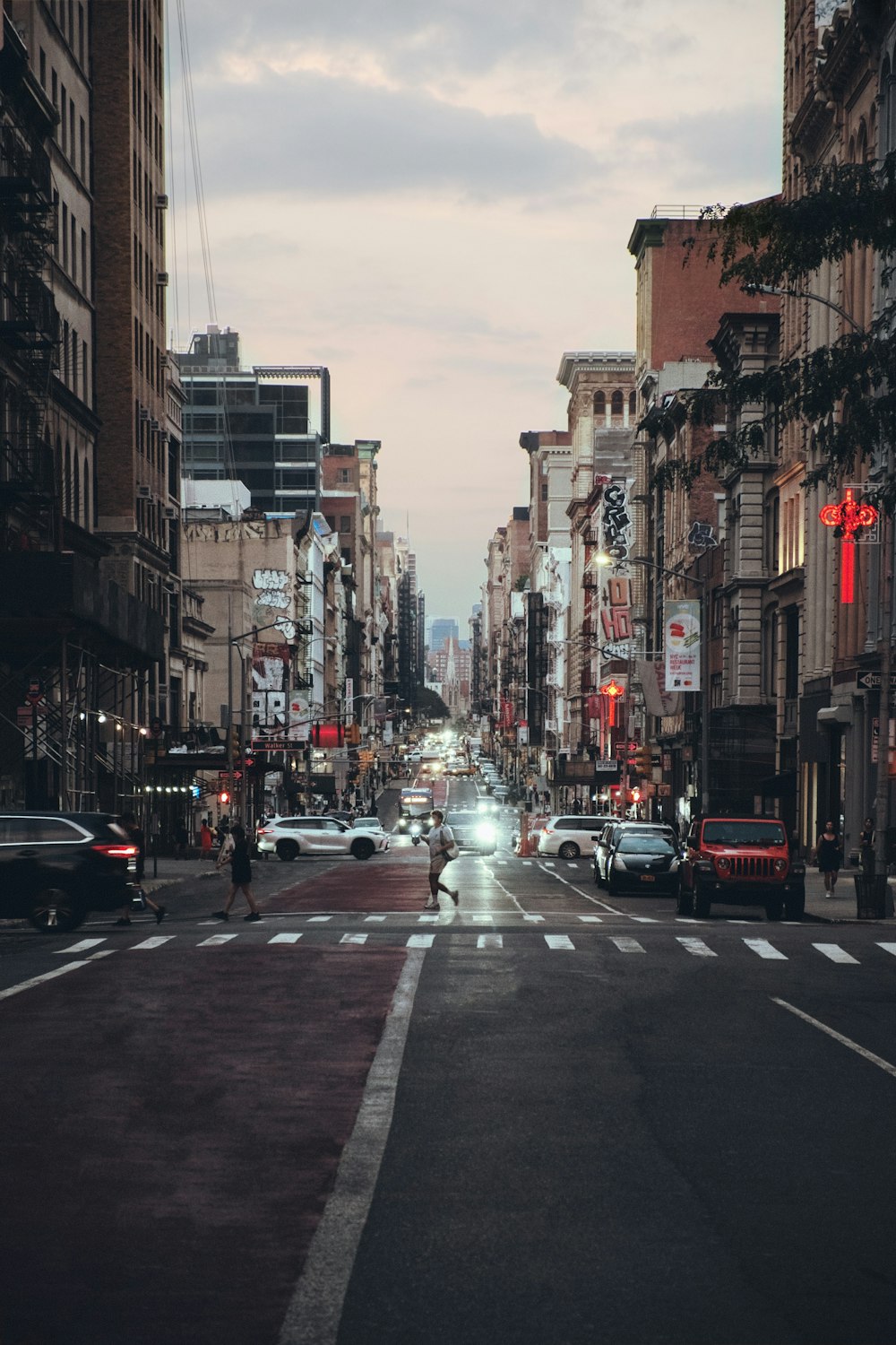 a city street filled with lots of tall buildings