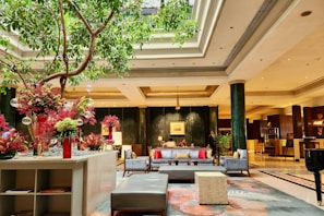 A luxurious hotel lobby with elegant decor and comfortable seating.