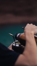 a close up of a person holding a steering wheel