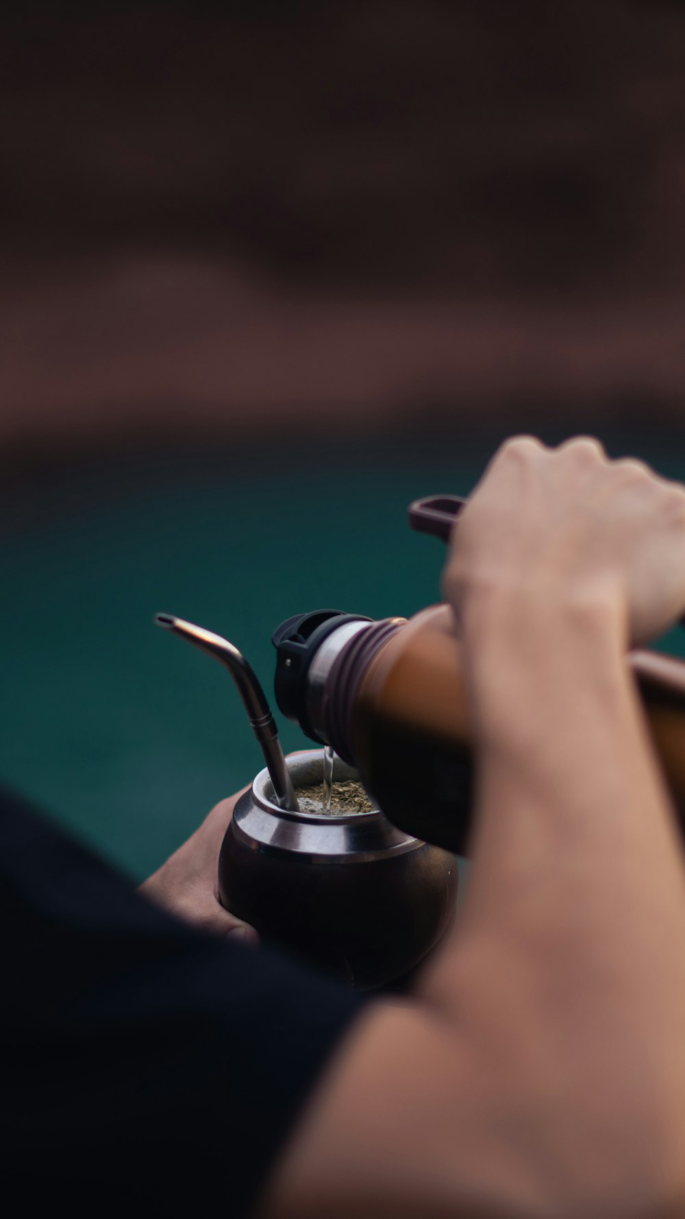 a close up of a person holding a steering wheel