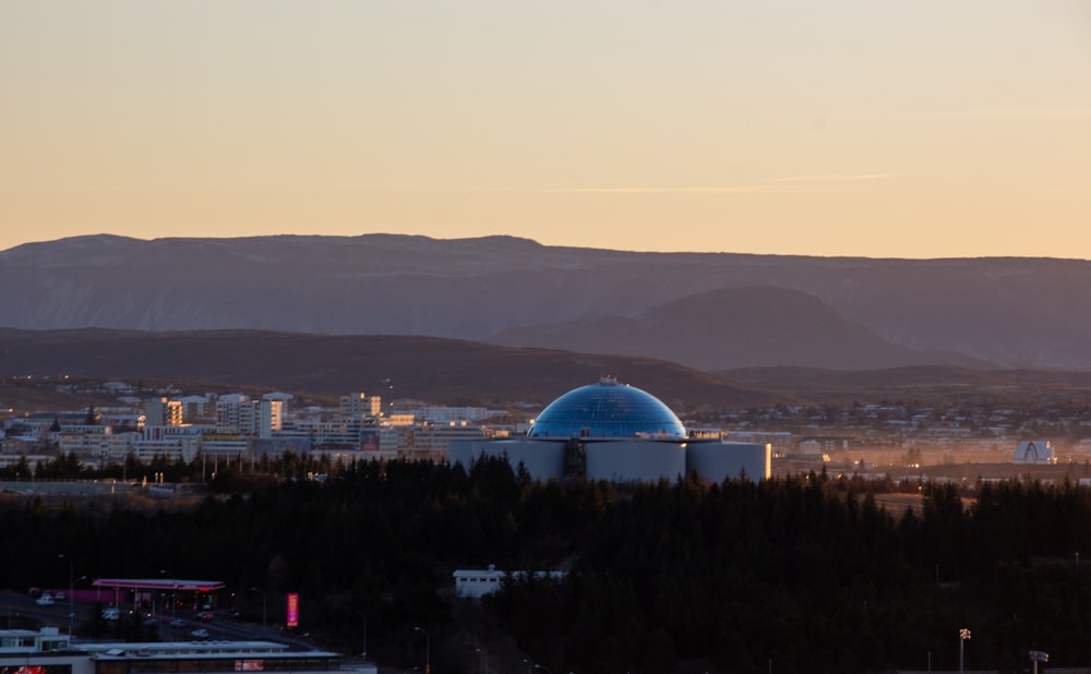 a view of a city with mountains in the background