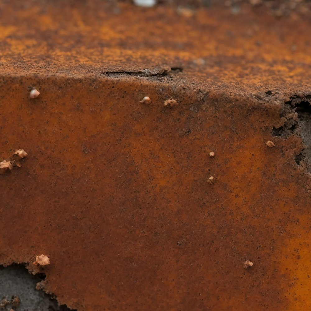 a close up of a rusted metal surface