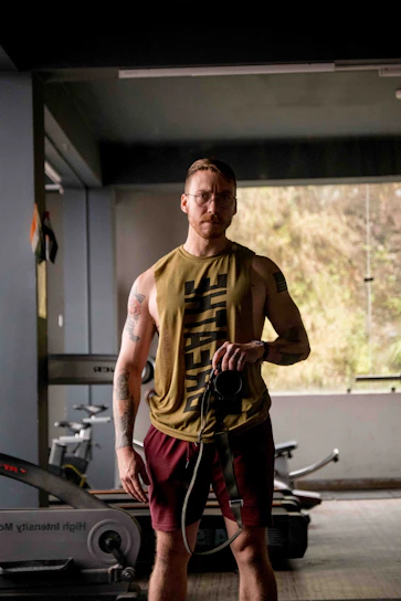 A professional photographer capturing dynamic shots in a vibrant fitness gym setting.