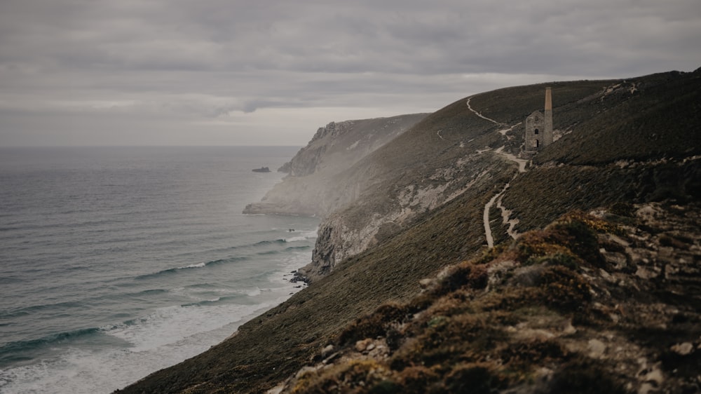 a view of the ocean from the top of a hill