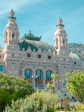 a large white building with a green roof