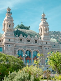 a large white building with a green roof