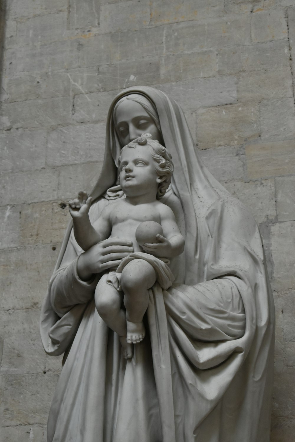 a statue of a woman holding a child