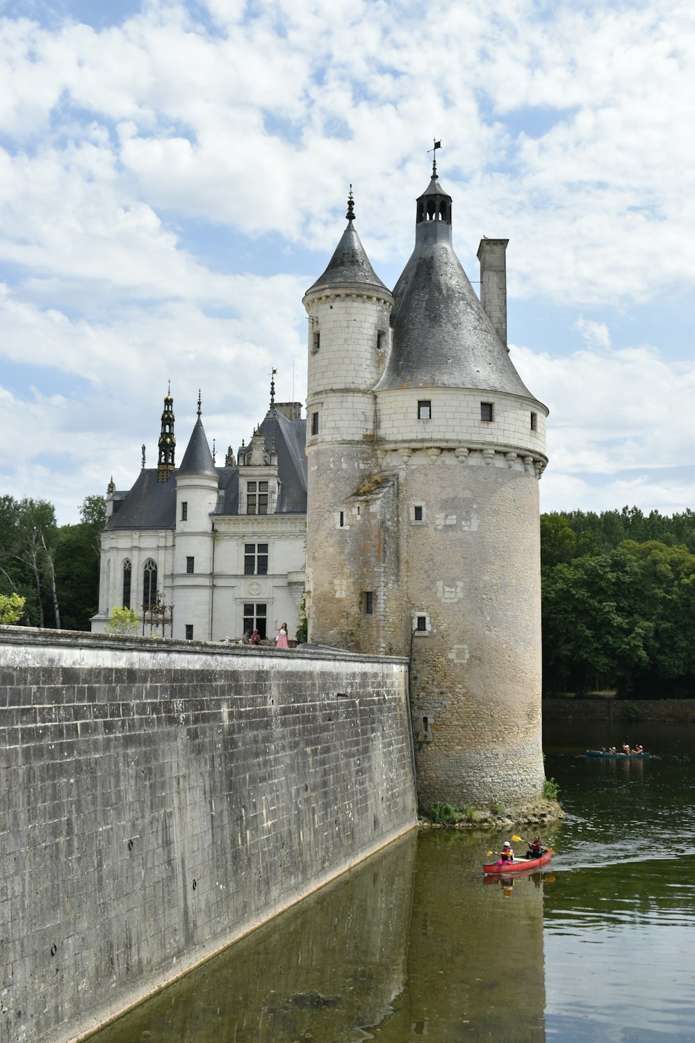 a castle sitting next to a body of water