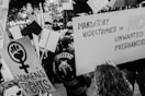 a group of people holding signs and protesting