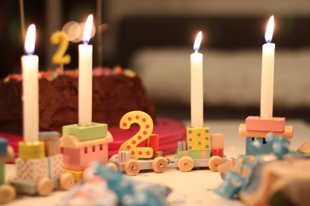 a close up of a birthday cake with candles