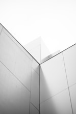 a black and white photo of a corner of a building
