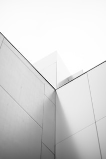 a black and white photo of a corner of a building