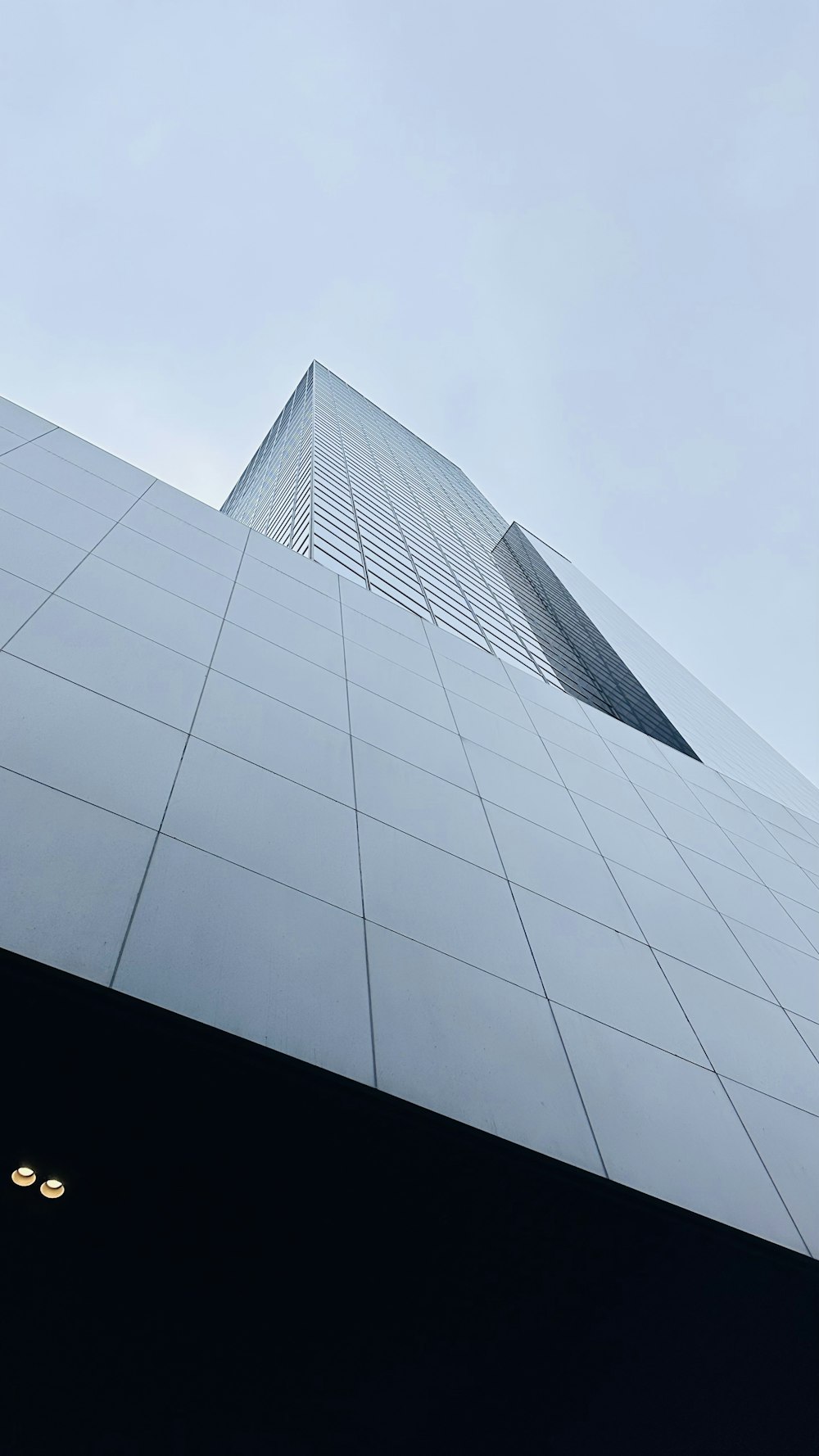 a very tall building with a sky background