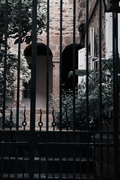 a tall brick building with a gated entrance