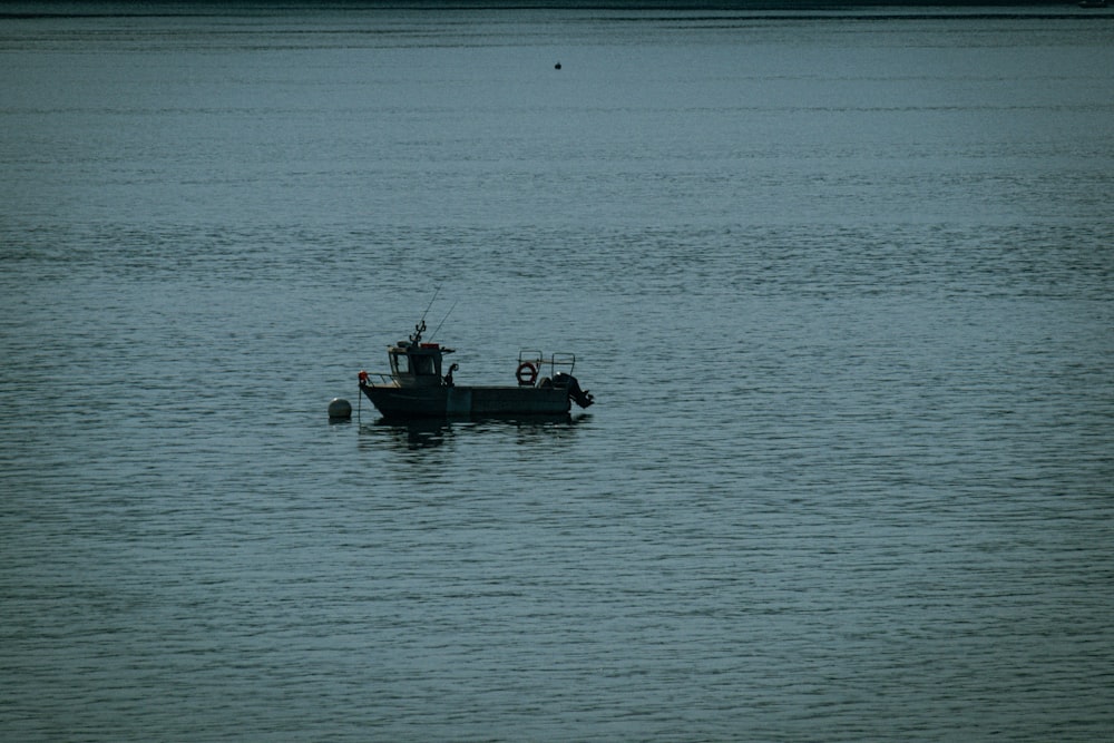 a boat floating on top of a large body of water