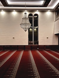 a large room with a chandelier hanging from the ceiling