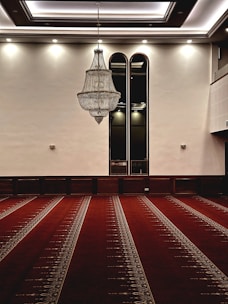a large room with a chandelier hanging from the ceiling