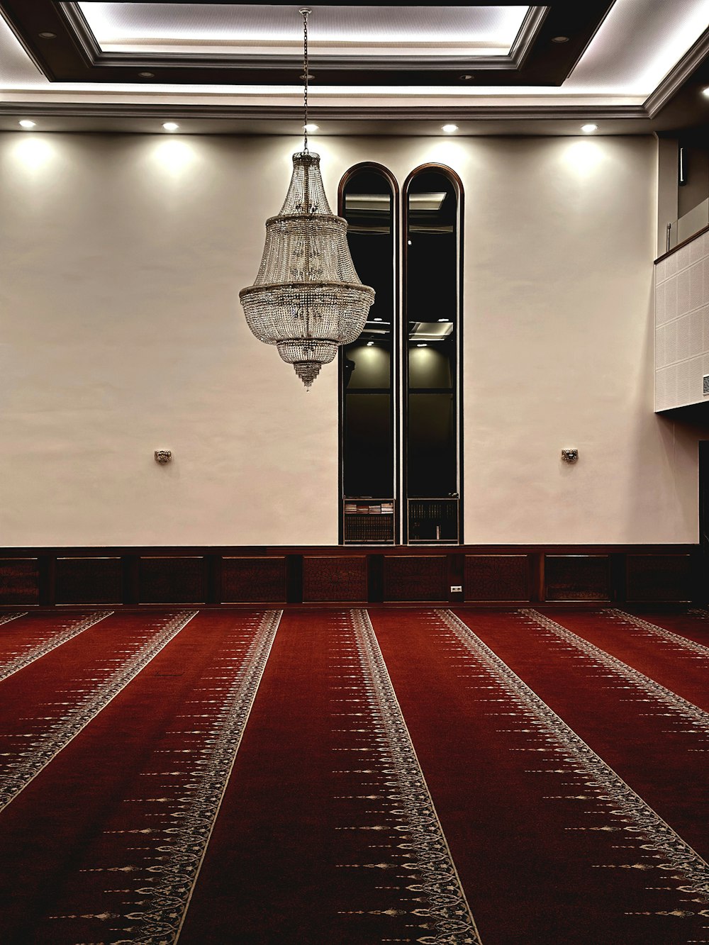 a large room with a chandelier hanging from the ceiling