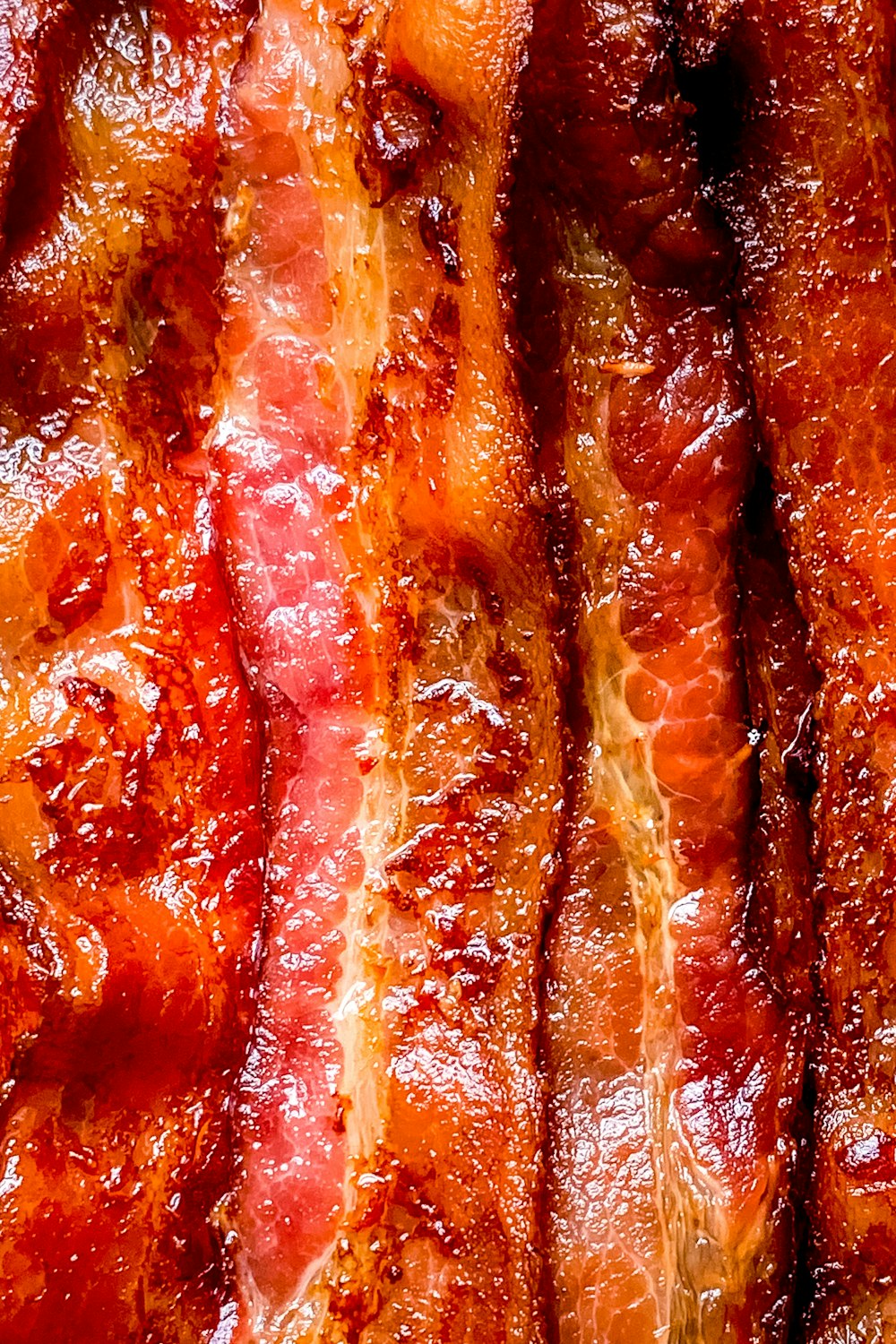 a close up of bacon on a plate