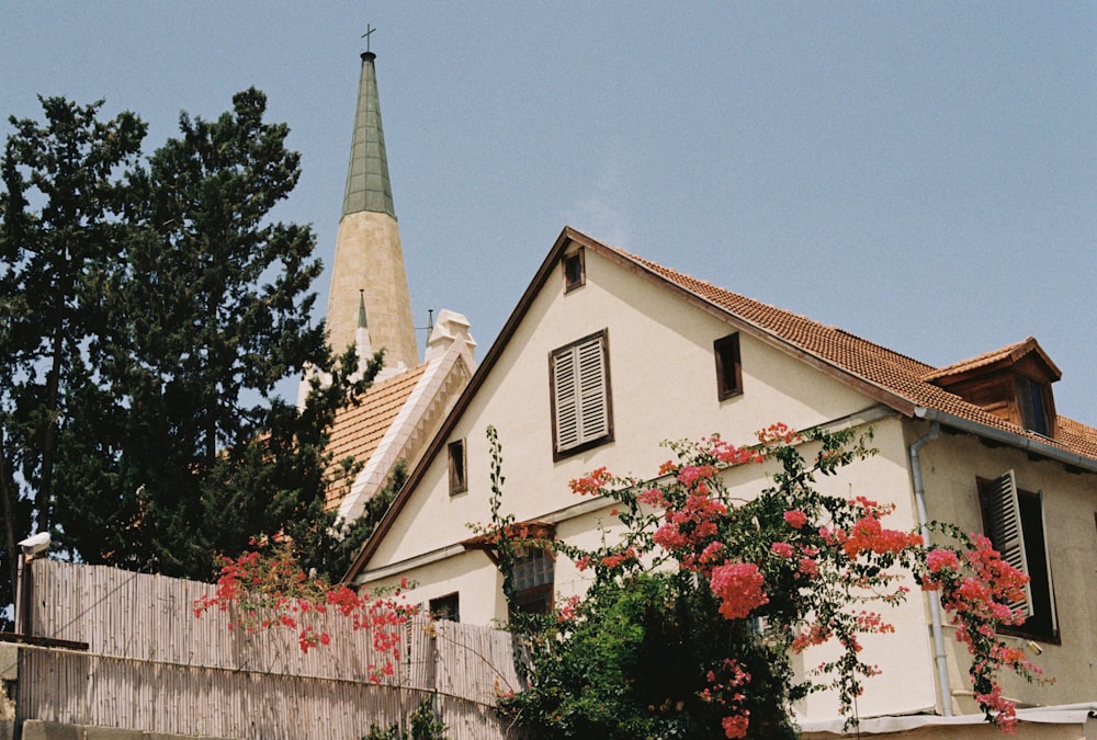 a house with a steeple in the background