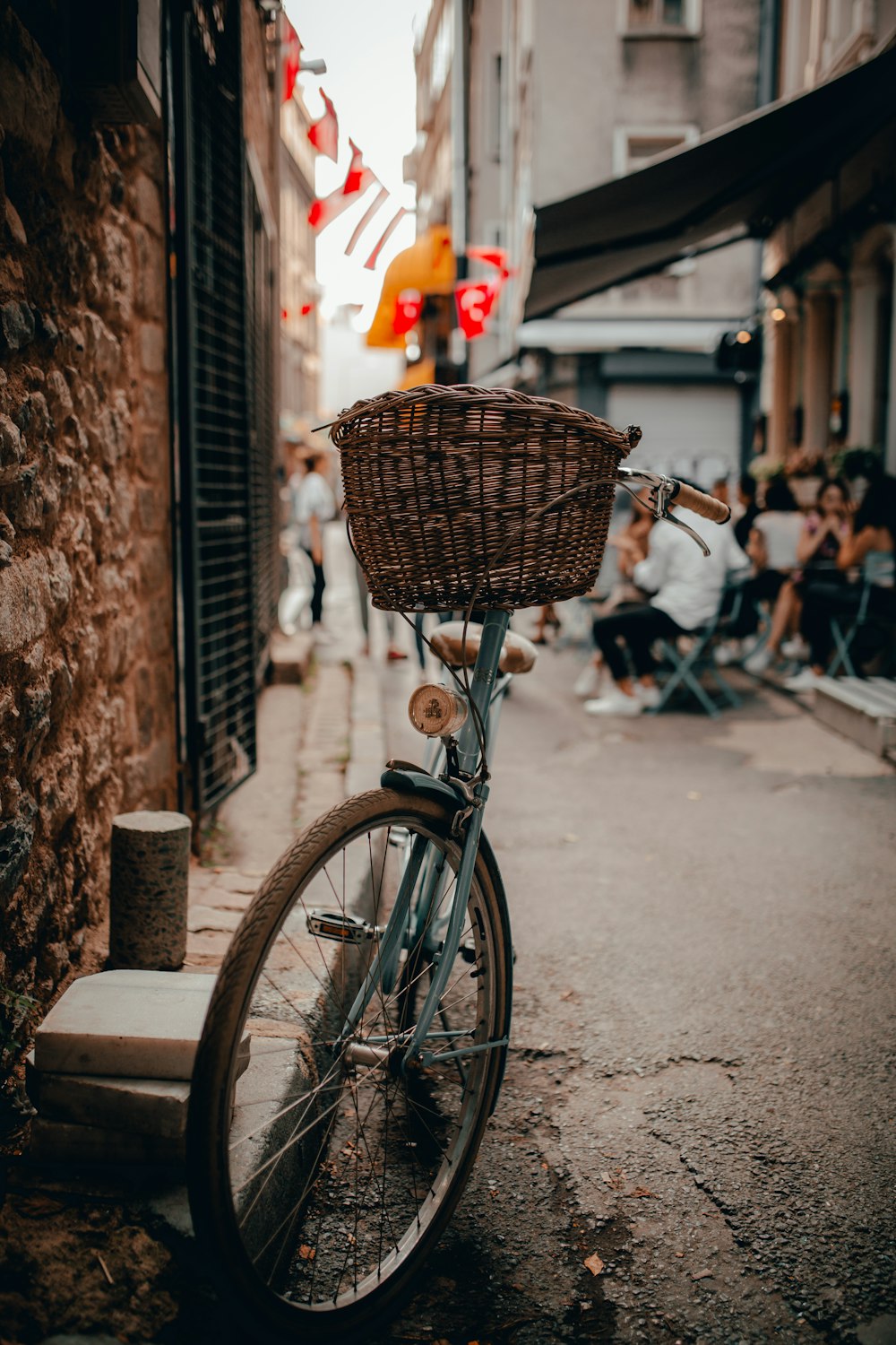 a bicycle parked on the side of a street