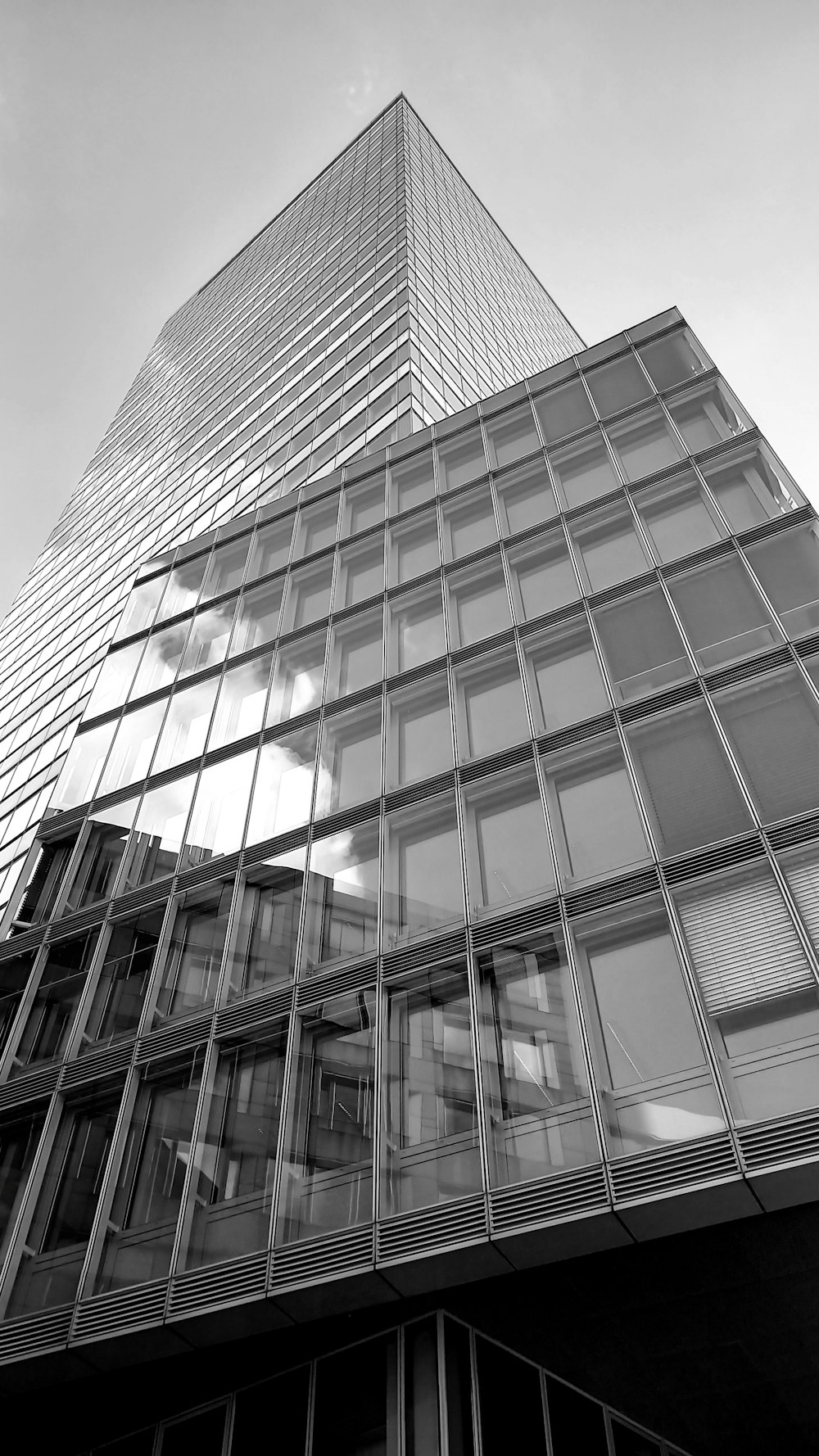 a black and white photo of a tall building