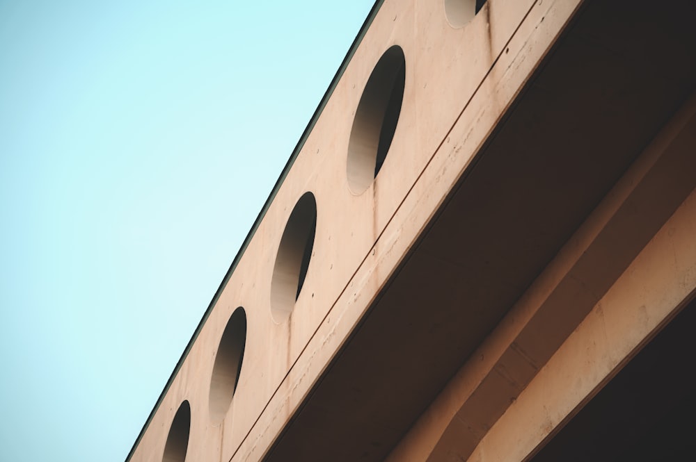 a close up of a building with a sky in the background