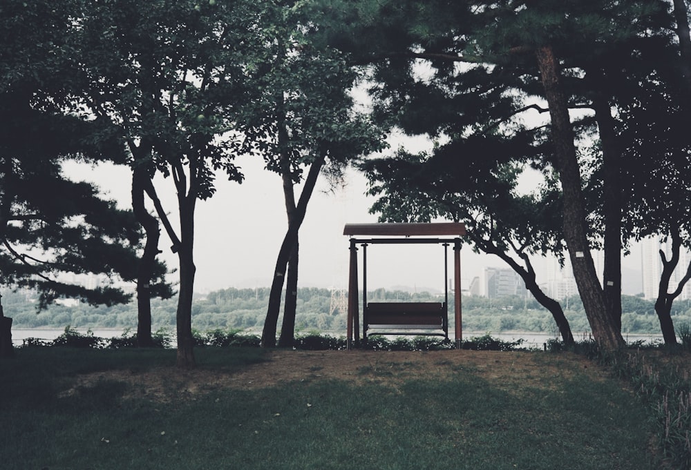 a bench sitting in the middle of a forest