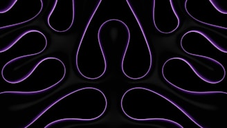 Flowing purple lines against a black background create a symmetrical pattern resembling abstract shapes or waves. The design appears smooth and glossy, giving a sense of movement and fluidity.
