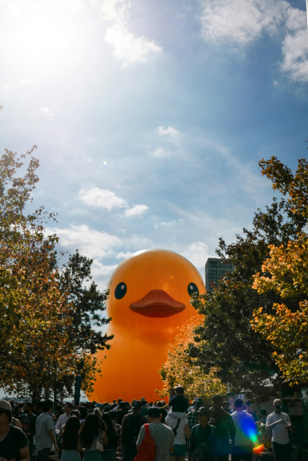 a large rubber ducky floating in the air