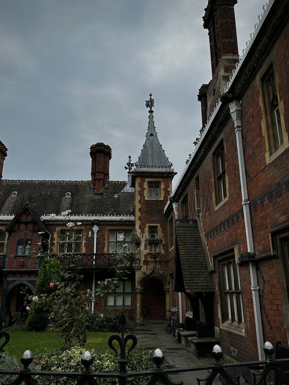 an old building with a steeple and a clock tower