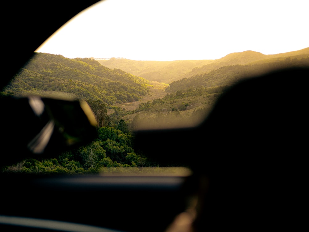 a view of a valley from inside a vehicle