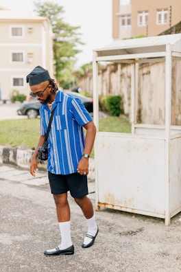 Young person walking casually on a city street wearing stylish espadrillas