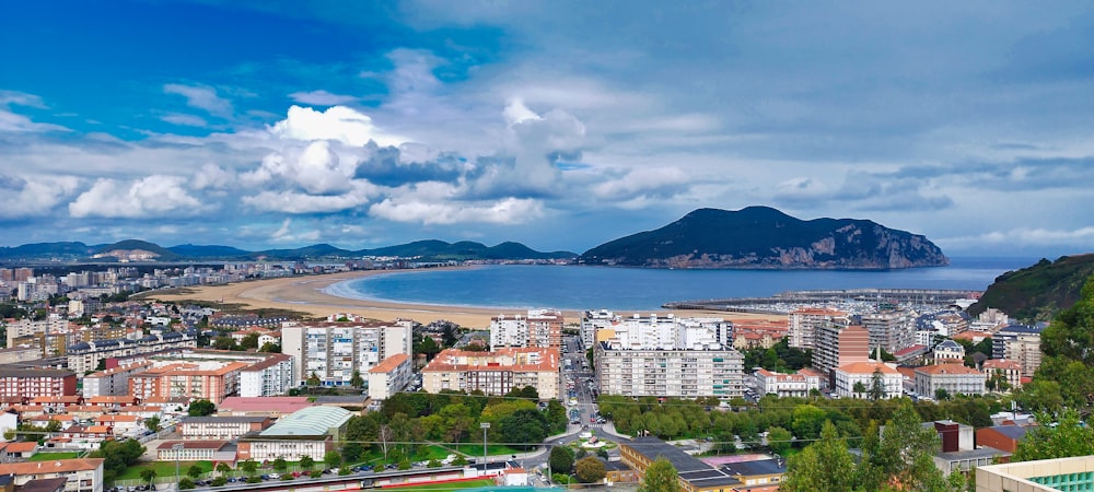 a view of a city with mountains in the background