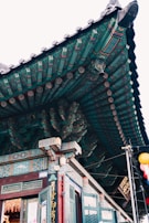 Close-up of the intricate woodwork and decorations on a classic Phnom Penh remorque.