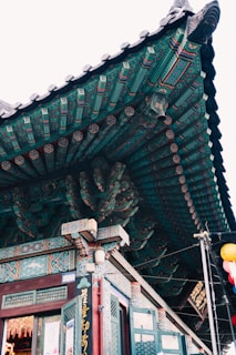 Close-up of the intricate woodwork and decorations on a classic Phnom Penh remorque.