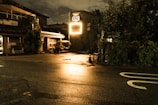 An eerie, dimly lit street corner bathed in neon glow, reminiscent of David Lynch's style.
