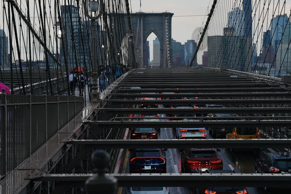 a bridge filled with lots of traffic next to tall buildings