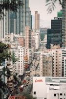 A panoramic view of a luxury block of flats near a bustling London street.