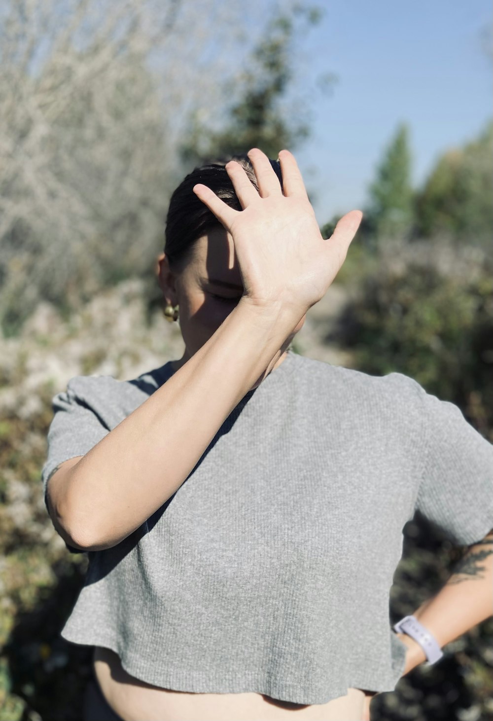 a woman with her hand on her head