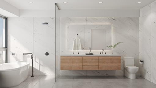 a bathroom with a tub, sink, and mirror