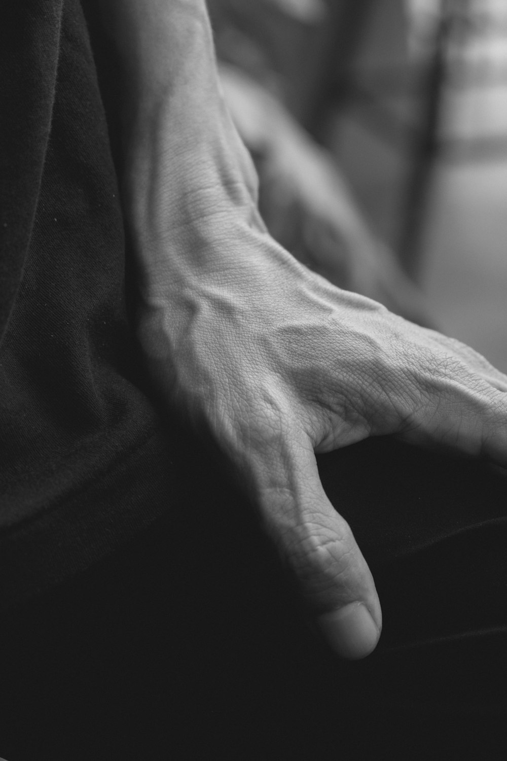 a black and white photo of a person's hands