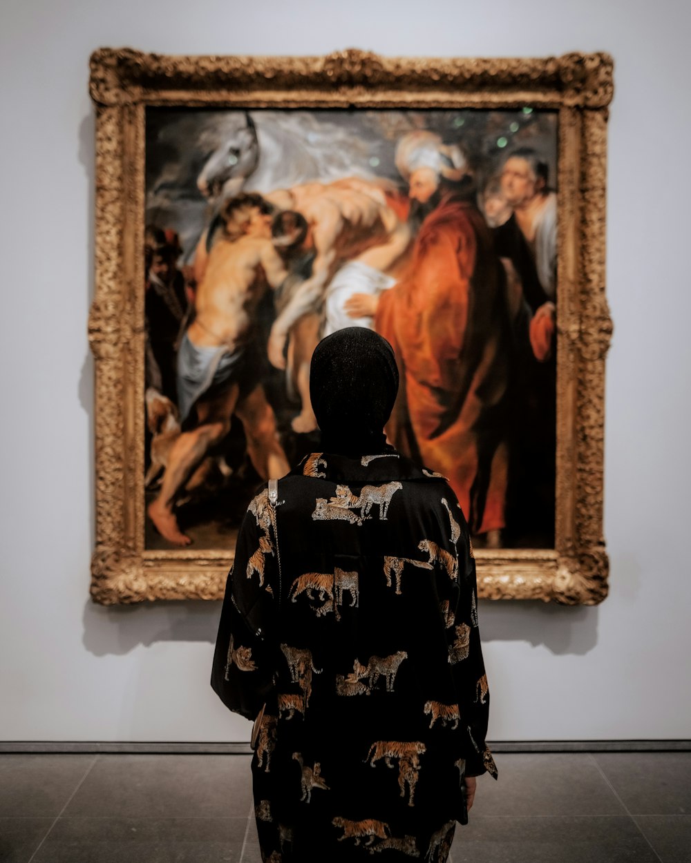 a person standing in front of a painting