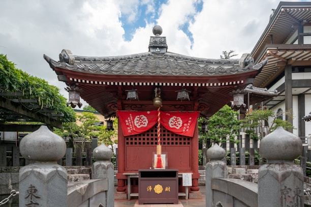 A historic black and white photo of the original village shrine during Japanese era.
