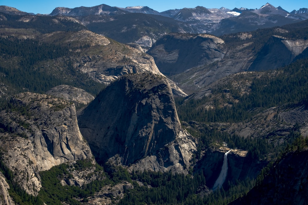 a mountain range with a waterfall in the middle of it