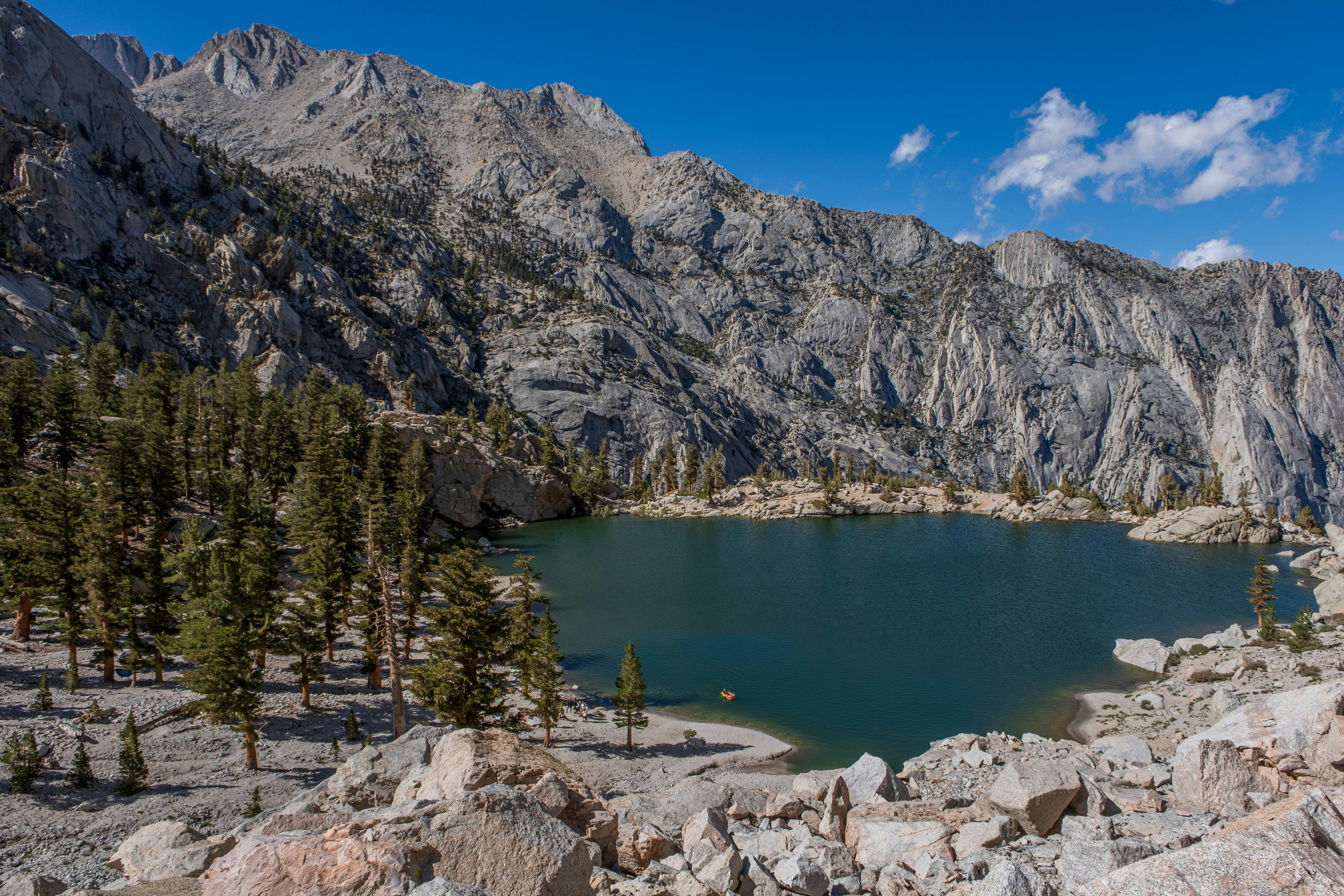 a mountain lake surrounded by rocks and trees