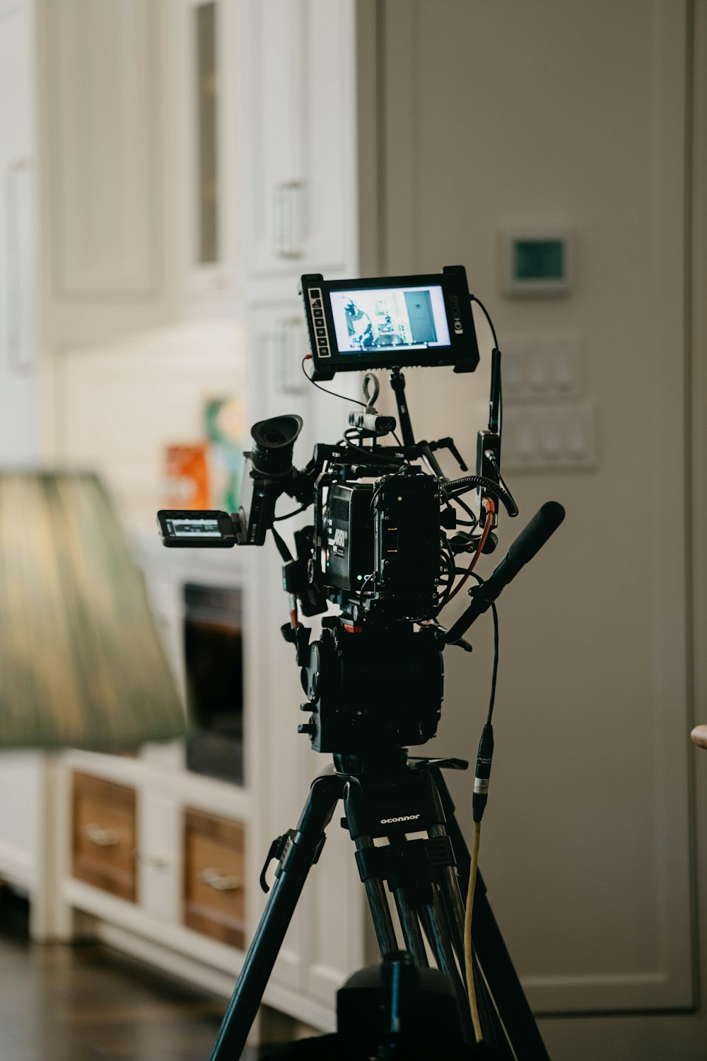 a camera set up on a tripod in a living room