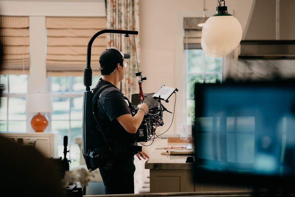 a man with a camera in a room